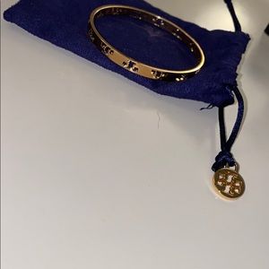 Tory Burch earnings and bracelet